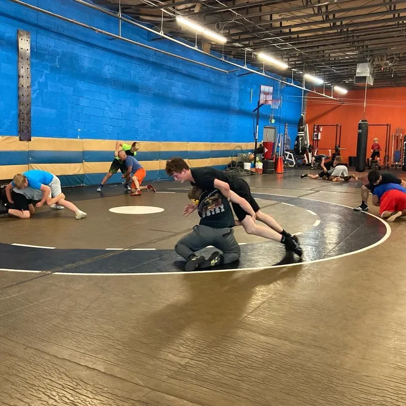 Young wrestlers drilling on the mat at The Well